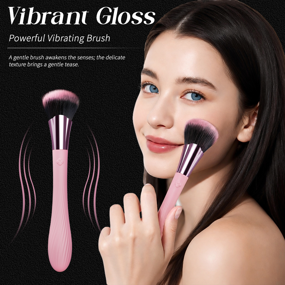 Vibrating makeup brush massager marketing image showing brush head and pink textured handle
